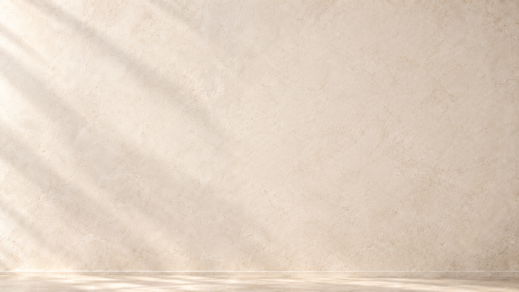 Softly lit pale stone and floor.